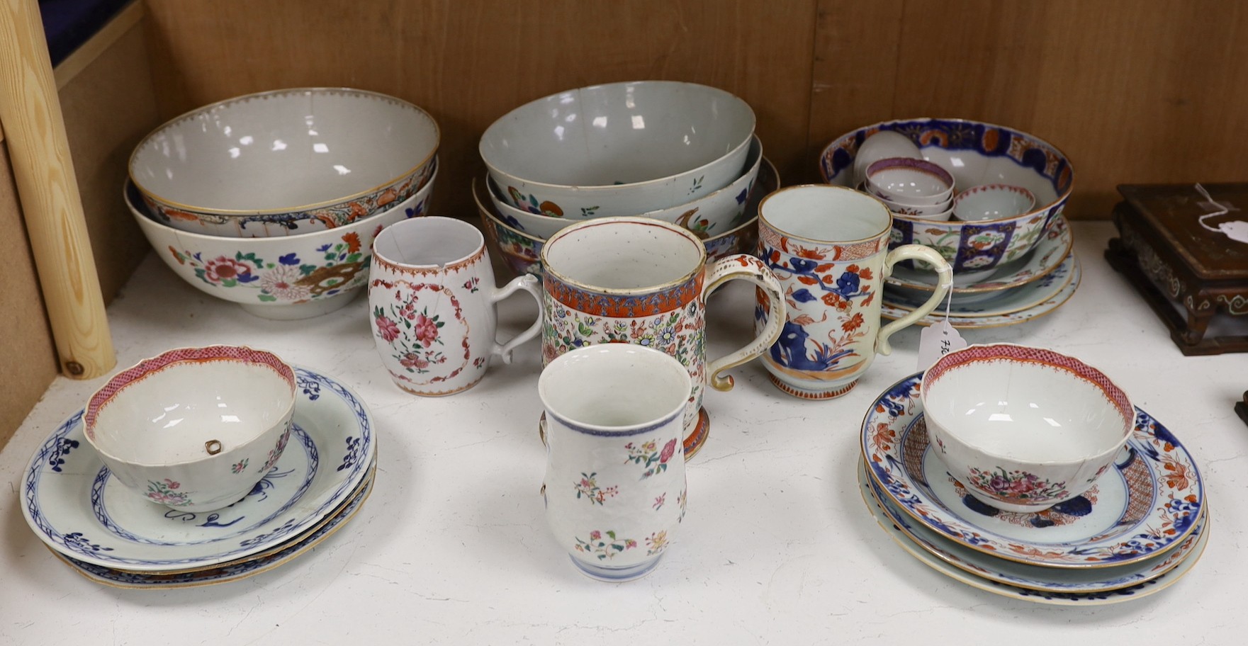 A large selection of 18th century Chinese export porcelain bowls, plates and mugs a/f